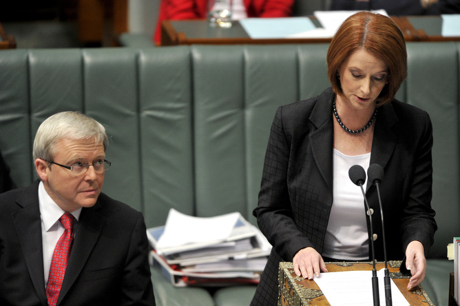 **FILE** A June 16, 2010 file photo of Prime Minister Kevin Rudd (left) listening to deputy prime minister Julia Gillard during House of Representatives question time in Canberra. Kevin Rudd will be sworn in as prime minister after winning a vote on the federal Labor leadership 57-45 over Julia Gillard on Wednesday night. (AAP Image/Alan Porritt, File) NO ARCHIVING